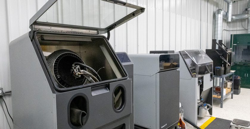Formlabs Fuse SLS printer beside its blast cabinet with the lid open